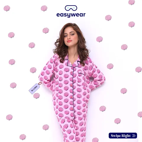Easywear post: woman in pink seashell-print pyjamas on a white background with pink shells
